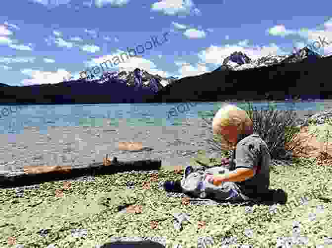 A Young Boy Sits On The Edge Of A Lake, Looking Out At The Water. He Is Wearing A Life Jacket And A Determined Expression. The Boy On The Lake: A True Story