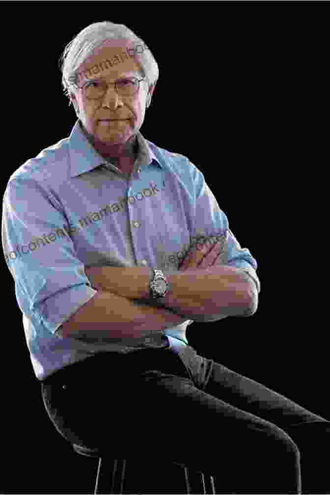 John Sandford, A Portrait Of The Author At His Desk, Surrounded By Books And Papers, Looking Intently At The Camera. The Investigator John Sandford